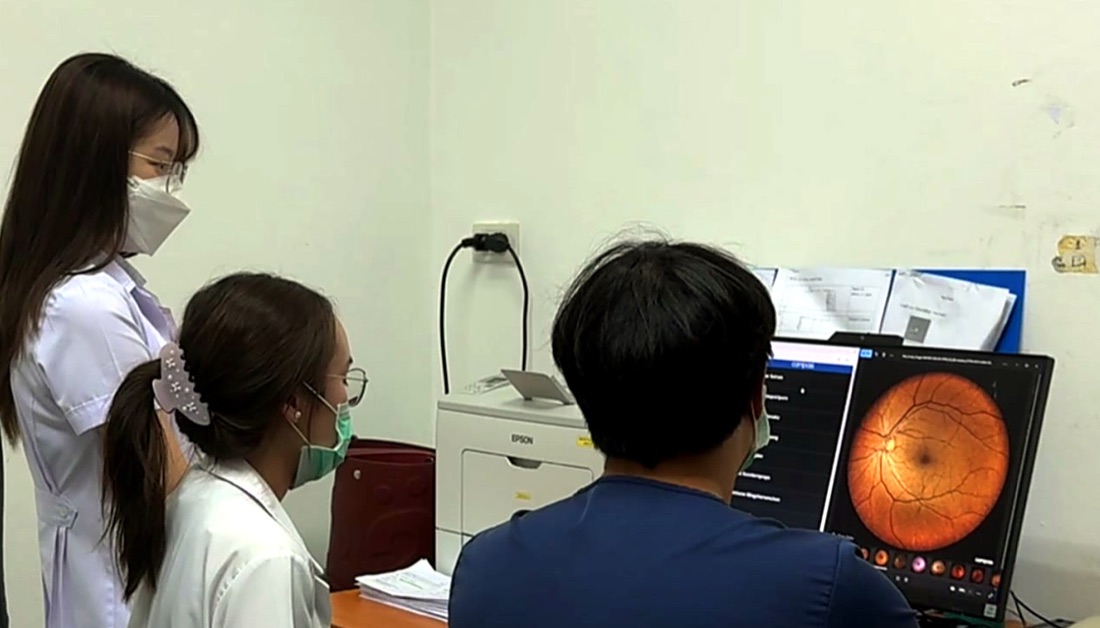 Clinicians reviewing a fundus image during a field session